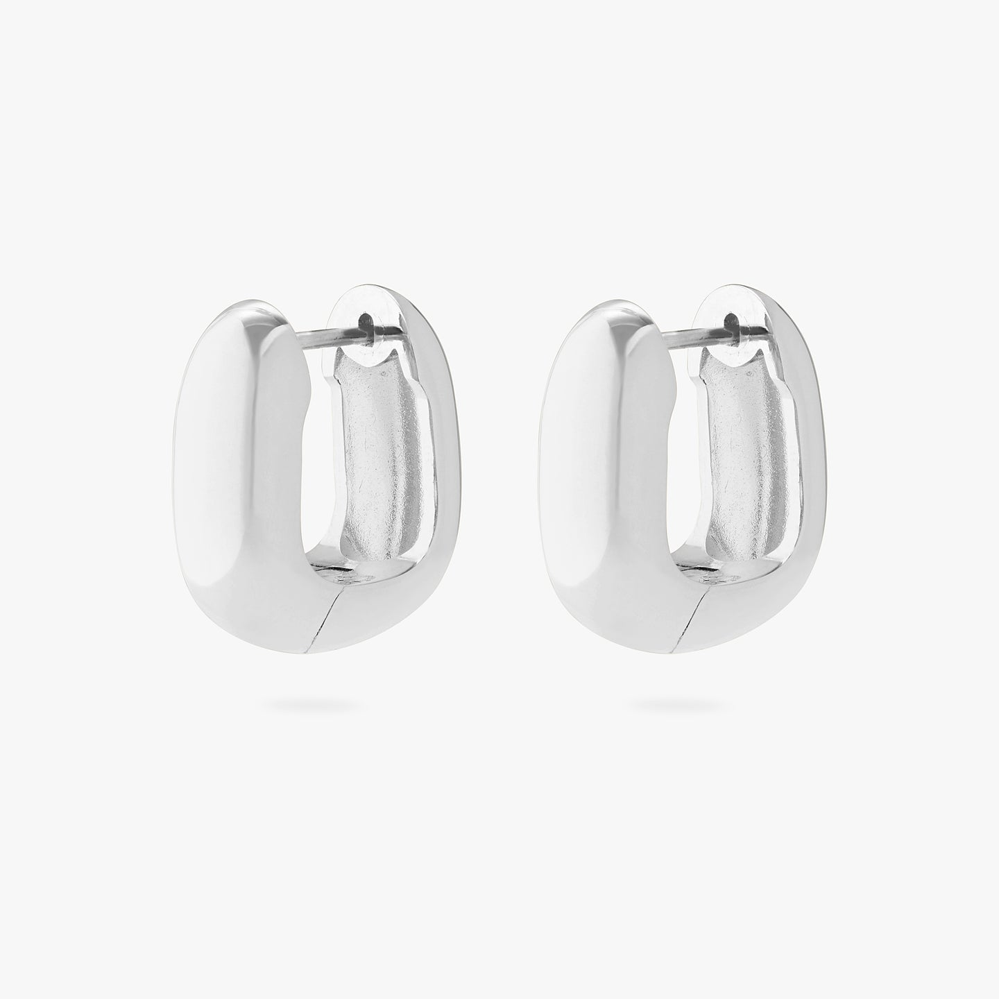 An image of a pair of silver, chunky, square shaped huggies. [pair] color:null|silver