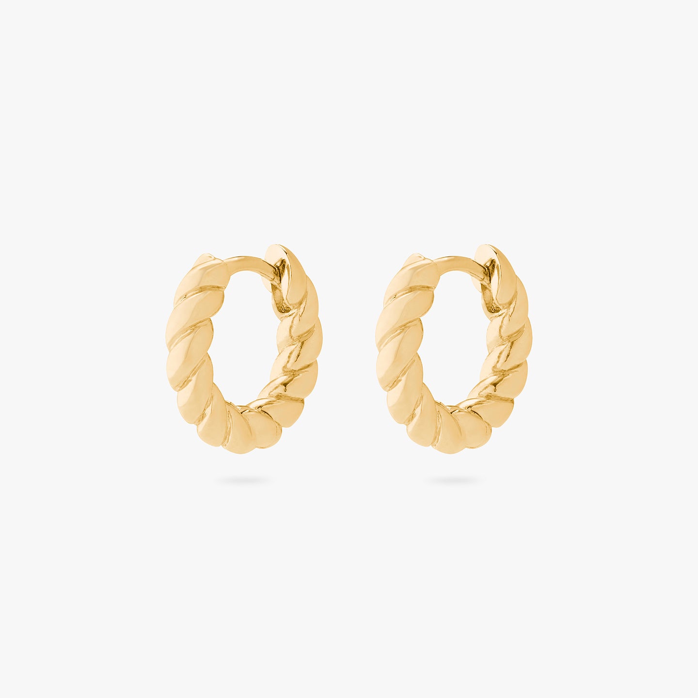 An image of a pair of chunky gold twisted huggies. [pair] color:null|gold