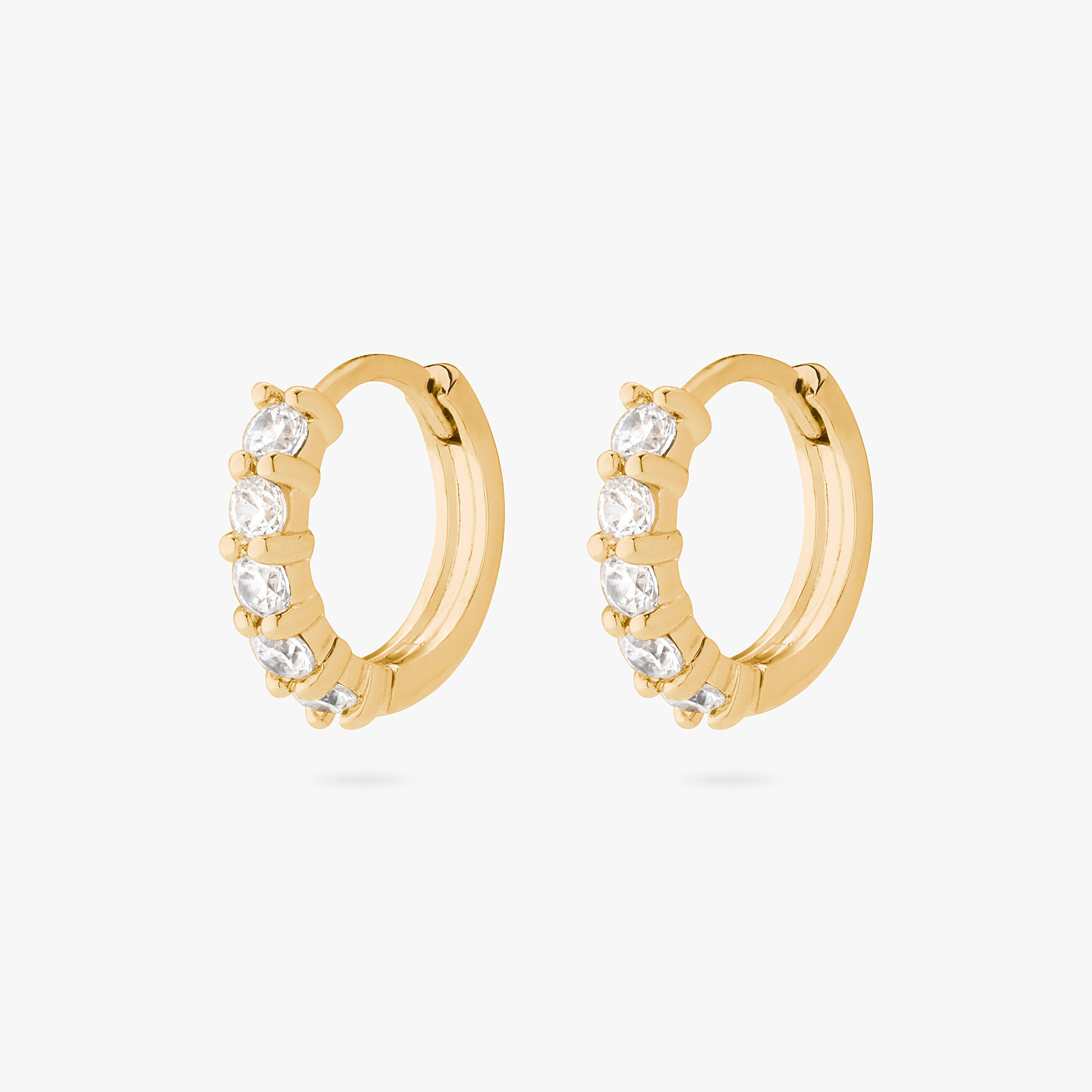 An image of a pair of gold/clear pave huggies with max pave stones. [pair] color:null|gold/clear