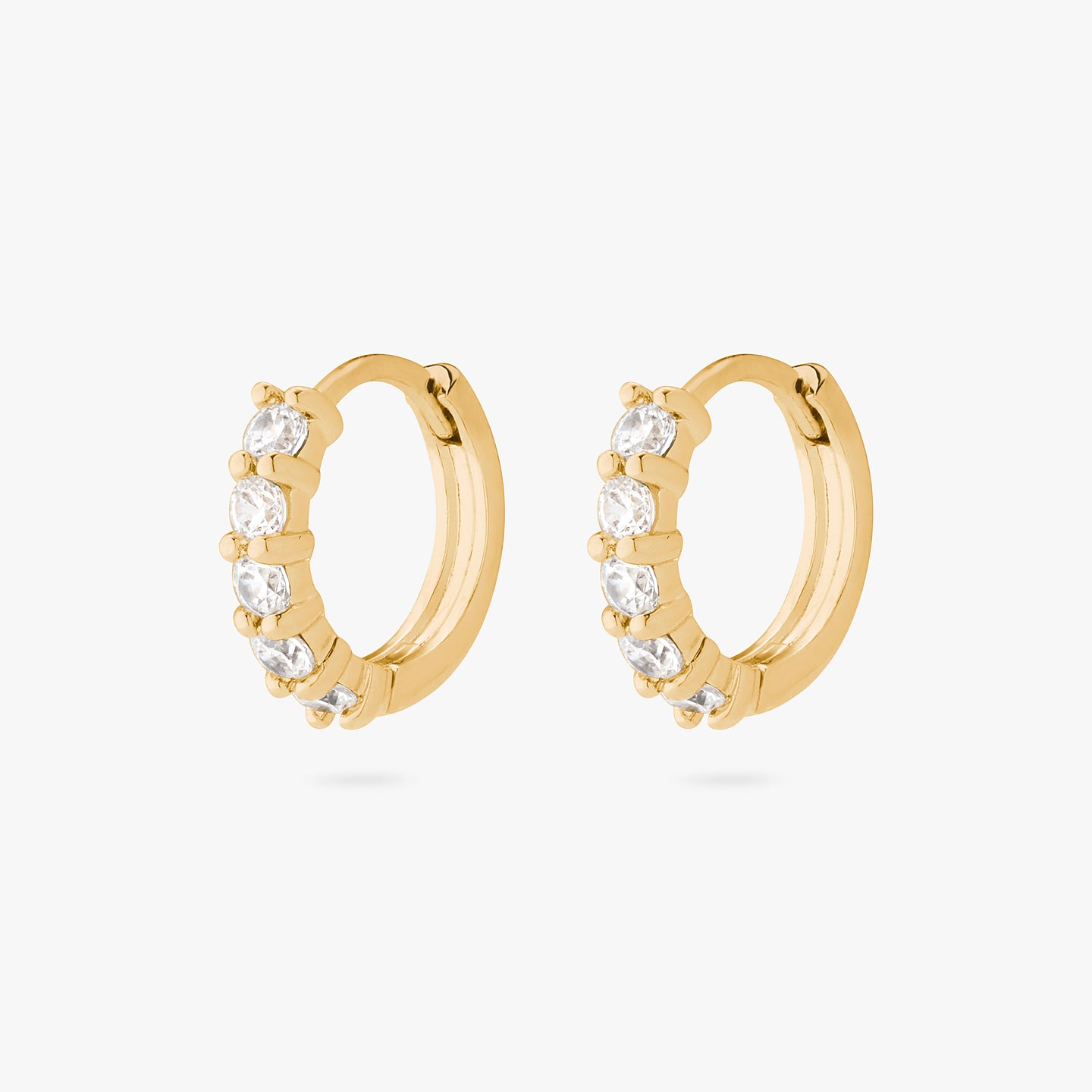 An image of a pair of gold/clear pave huggies with max pave stones. [pair] color:null|gold/clear