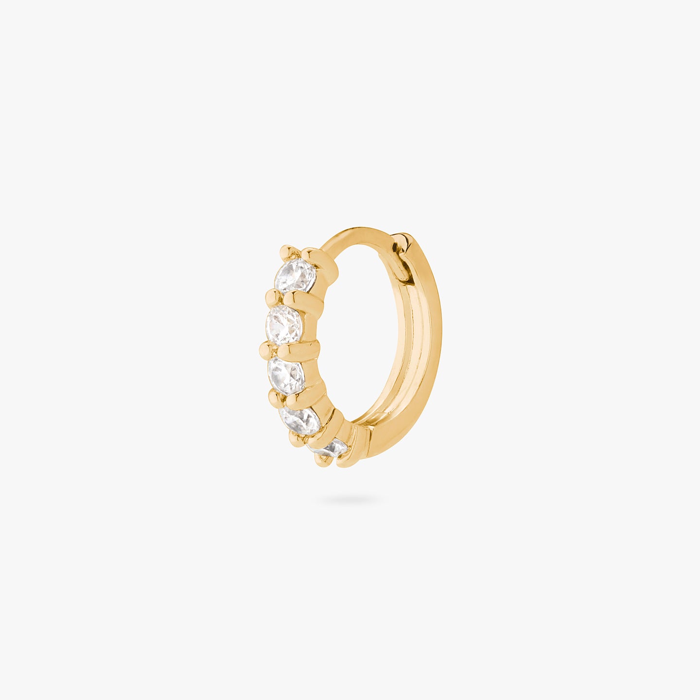 An image of a gold/clear pave huggie with max pave stones. color:null|gold/clear