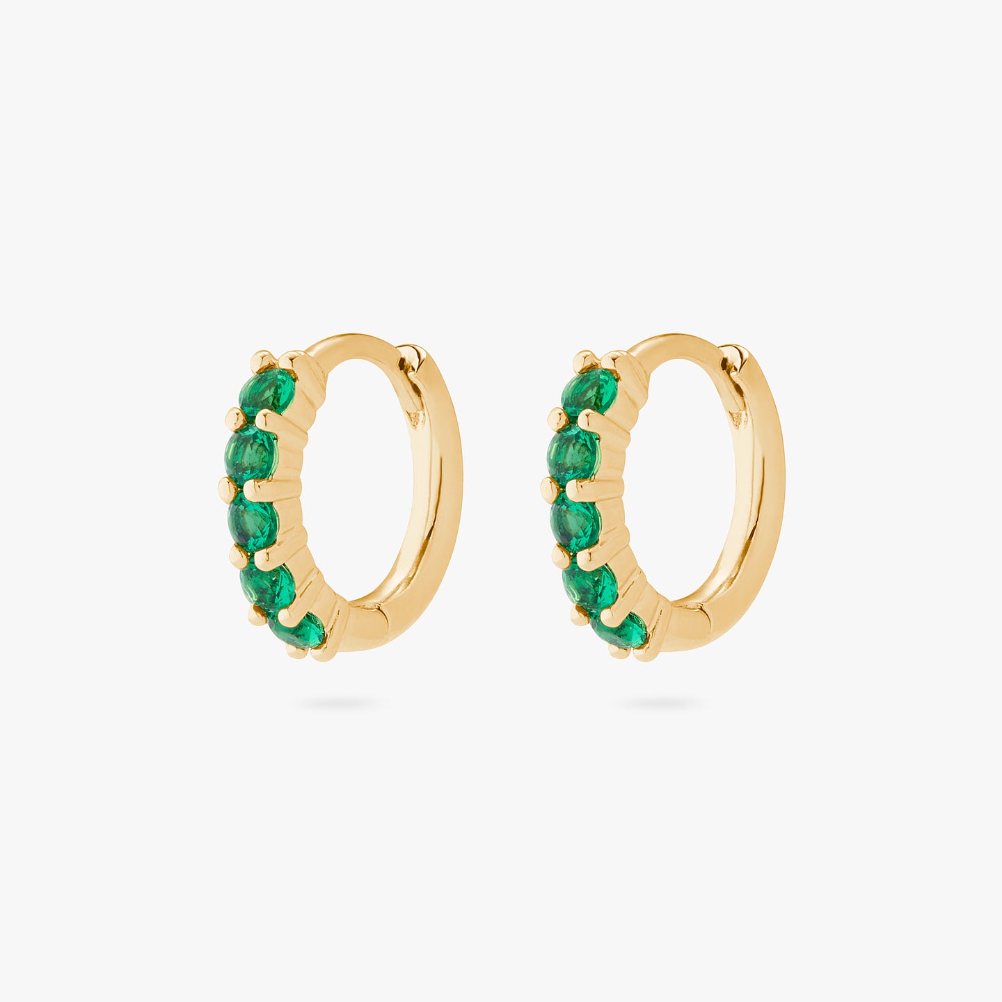 An image of a pair of gold/green pave huggies with max pave stones. [hover]  [pair] color:null|gold/green
