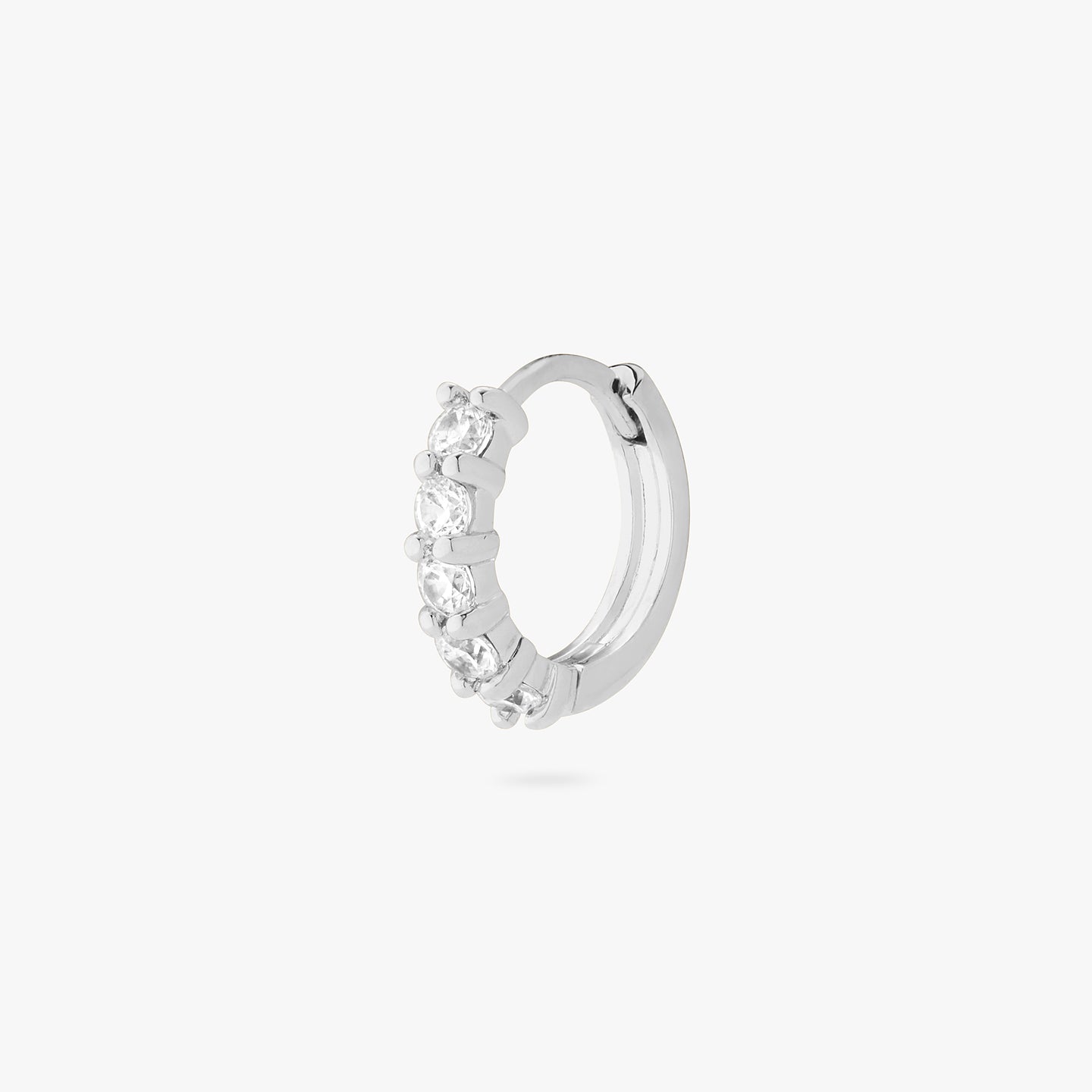 An image of a silver/clear pave huggie with max pave stones. color:null|silver/clear