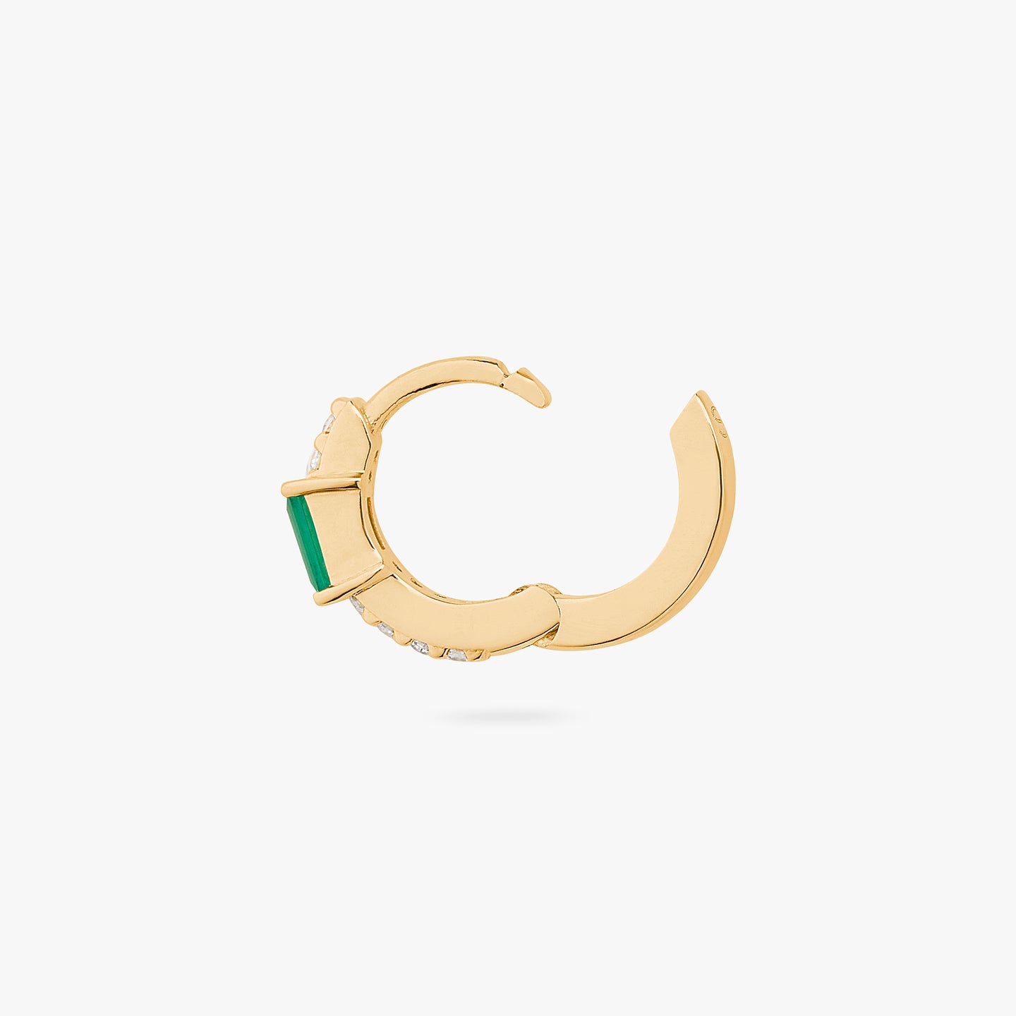 An image of a gold/clear huggie with a green accent baguette CZ stone unhinged. color:null|gold/green