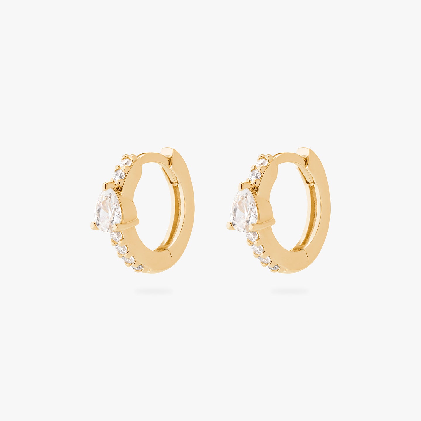 An image of a pair of gold/clear mini pave huggies with a clear pear shaped CZ accent stone. [pair] color:null|gold/clear