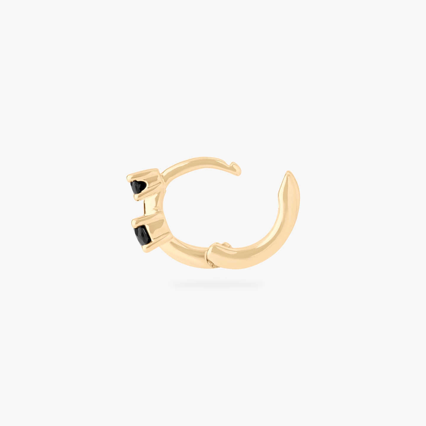 micro huggie in gold with 2 mini black cz stones color:null|gold/black