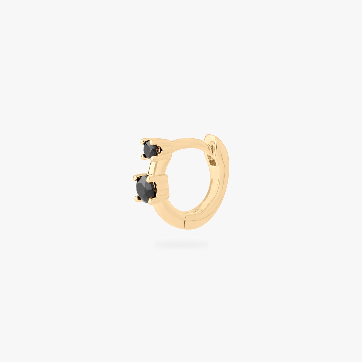 micro huggie in gold with 2 mini black cz stones color:null|gold/black