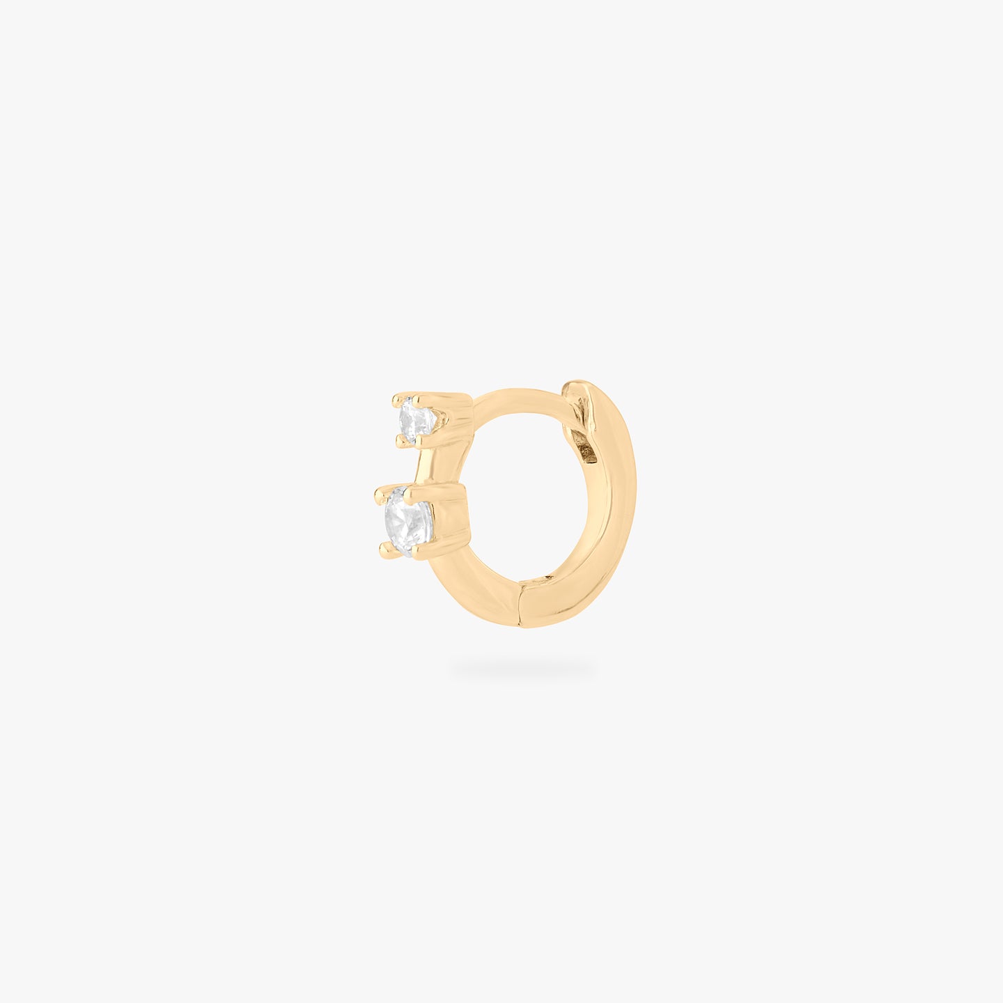 micro huggie in gold with 2 mini cz stones color:null|gold/clear