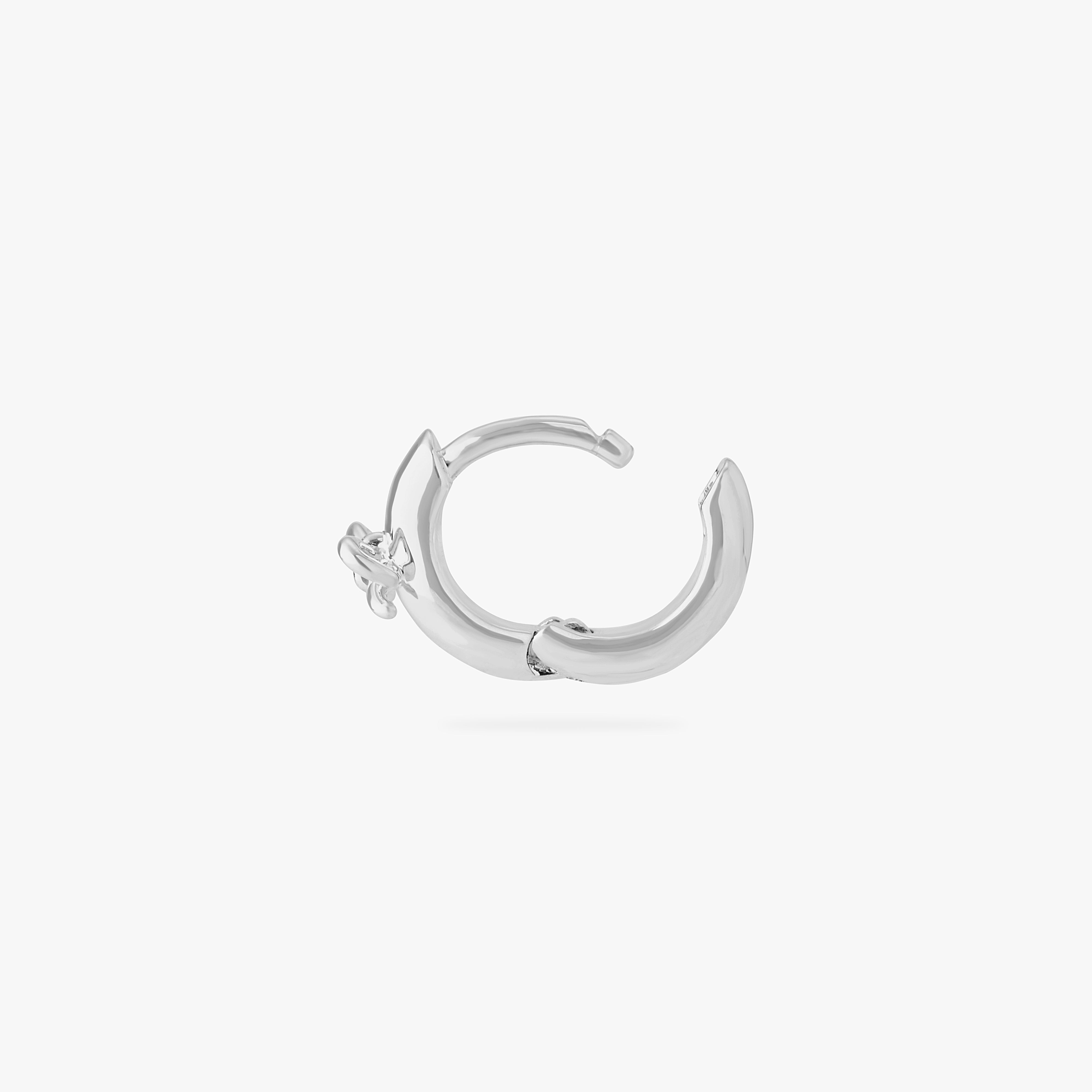 micro huggie with a small bow accent in silver color:null|silver