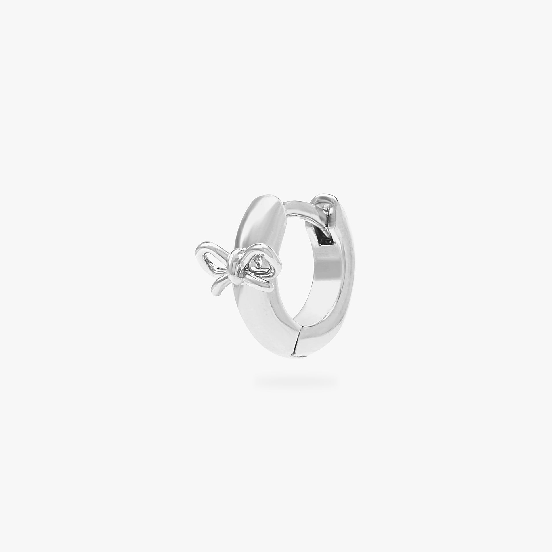 micro huggie with a small bow accent in silver - Main view