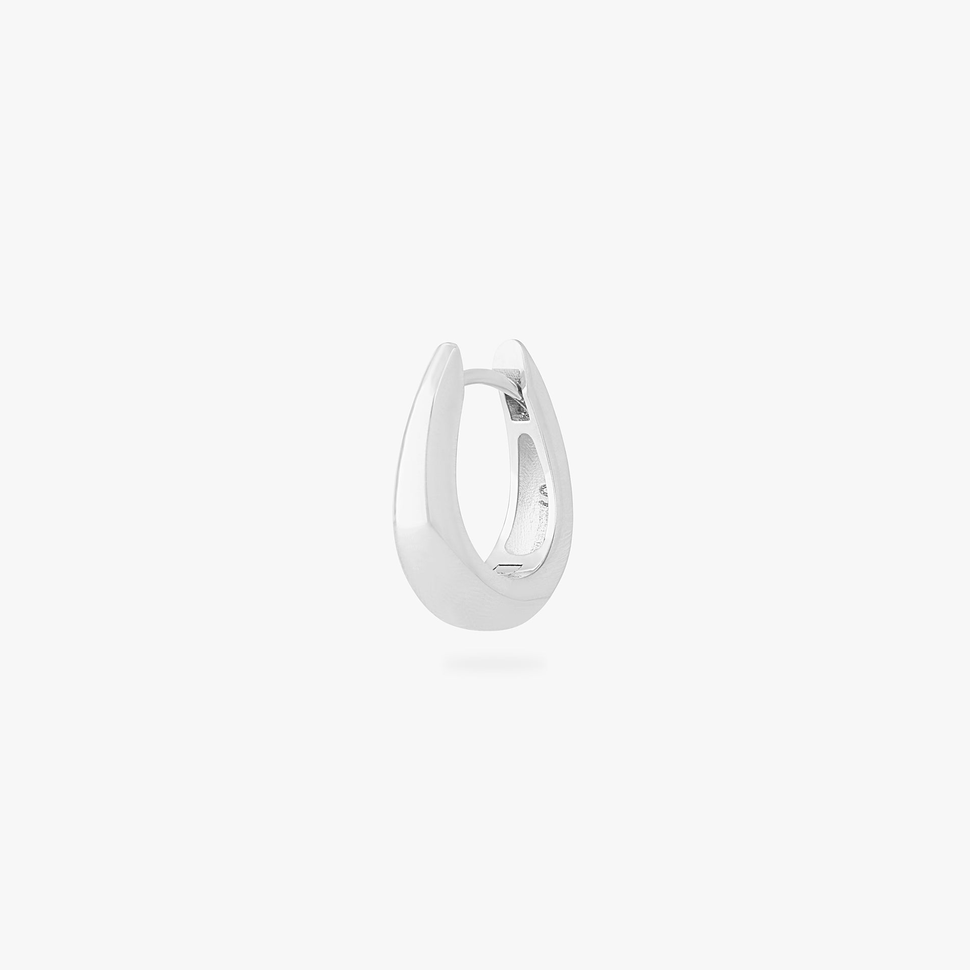 This is an image of a silver-toned, small, crescent shaped huggie. color:null|silver