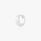 This is an image of a silver-toned huggie with twinkle star shaped engravings with CZs in them. color:null|silver/clear