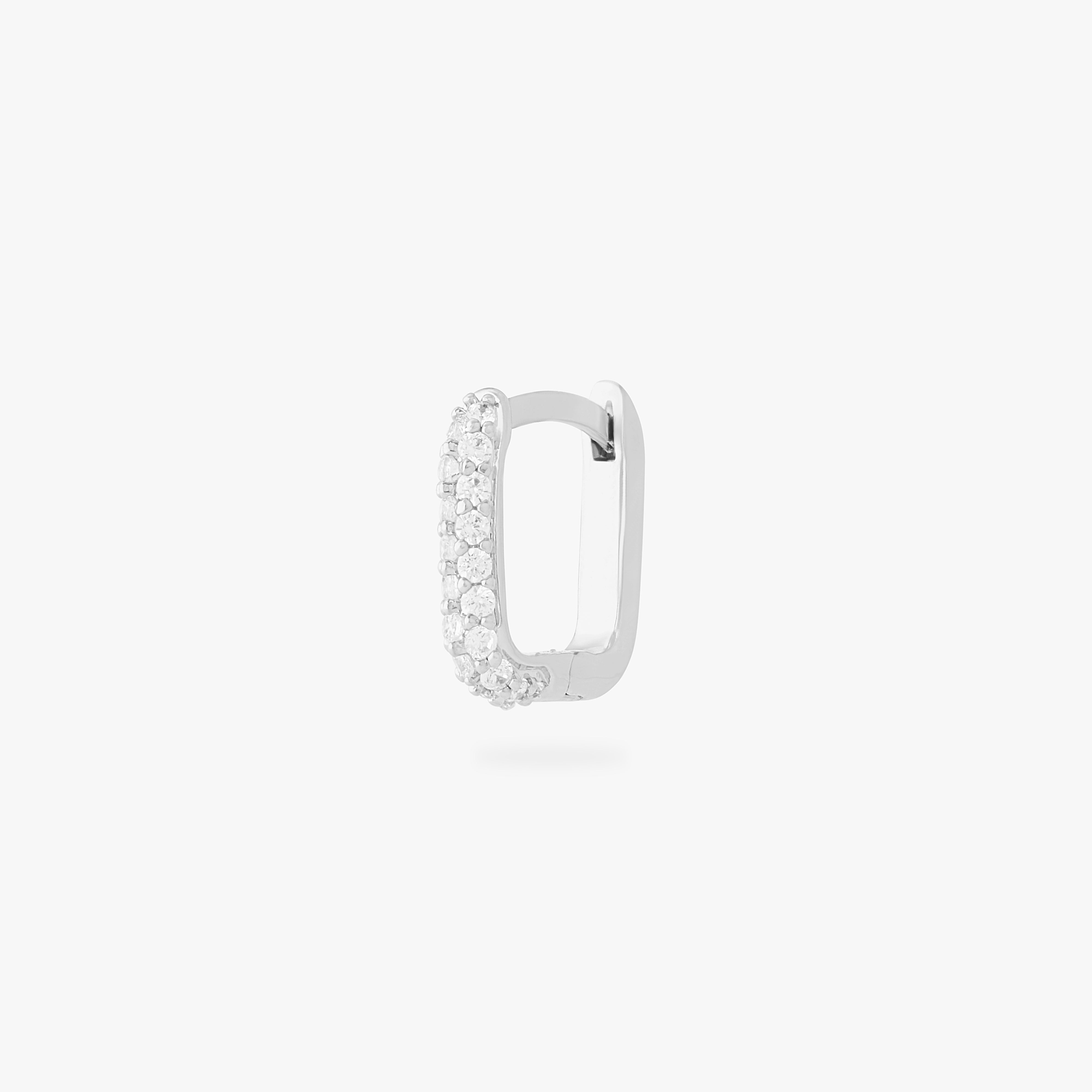 This is an image of a silver-toned, square-shaped huggie with pave CZ stones. color:null|silver/clear