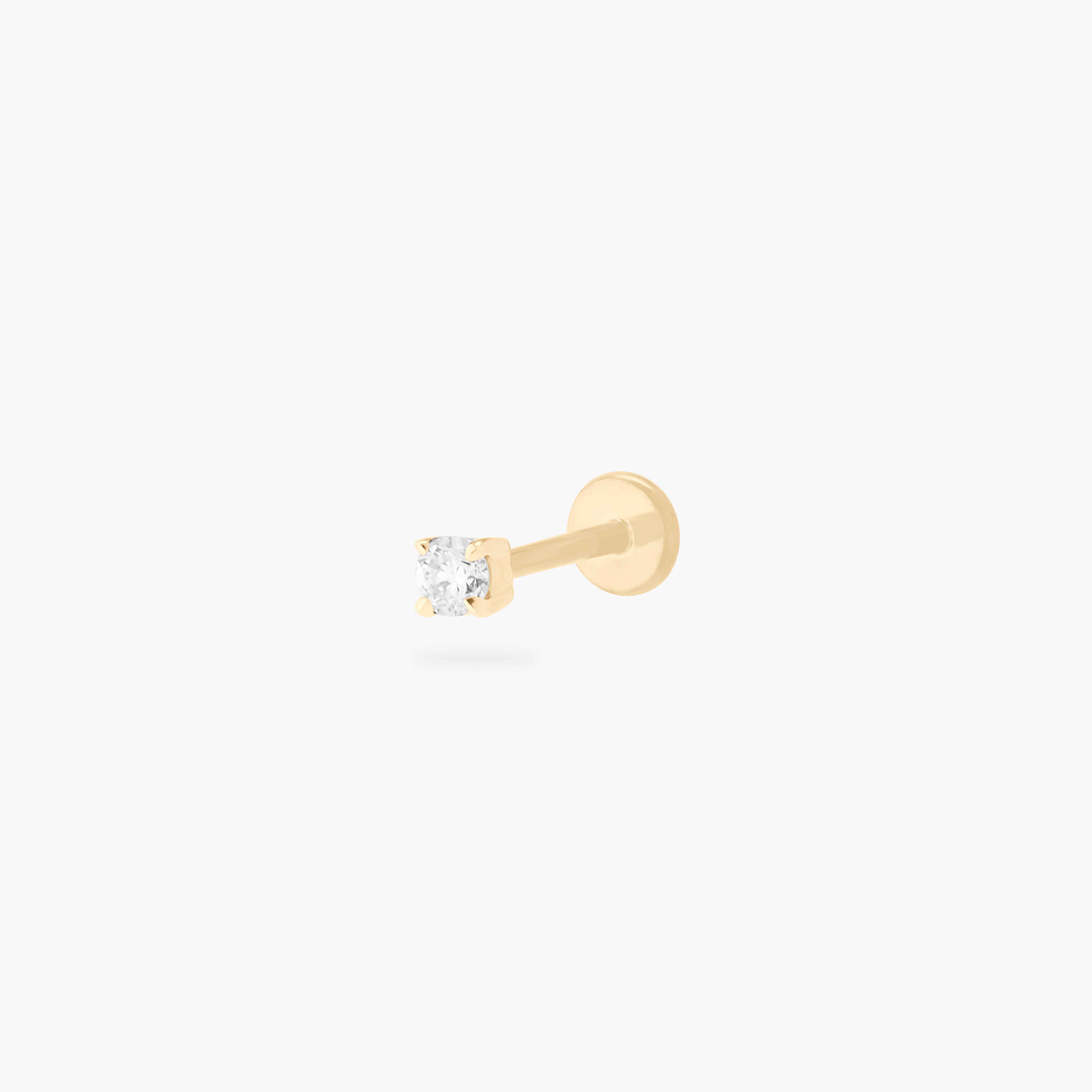 This image displays a 14K gold flatback stud featuring a round lab grown diamond against a white background. 