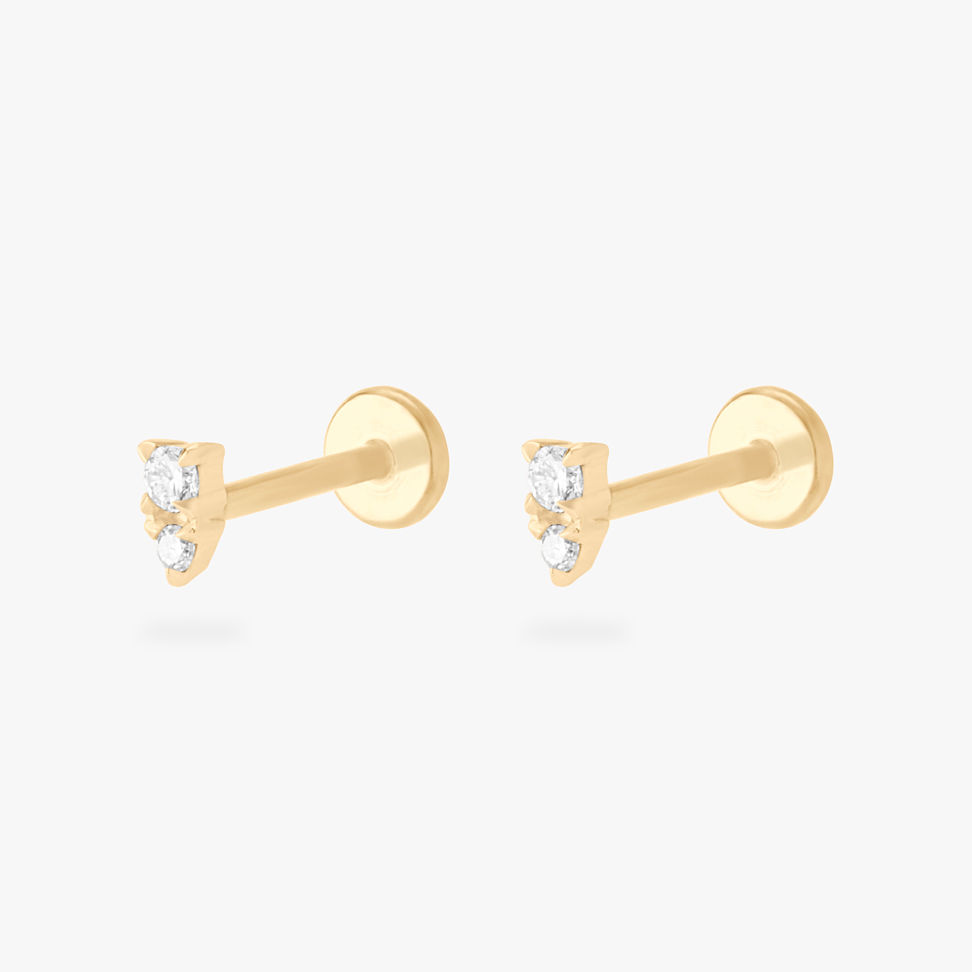 This is an image of a pair of gold flatback studs with clear stacked cz stones. [pair] color:null|14k gold/clear