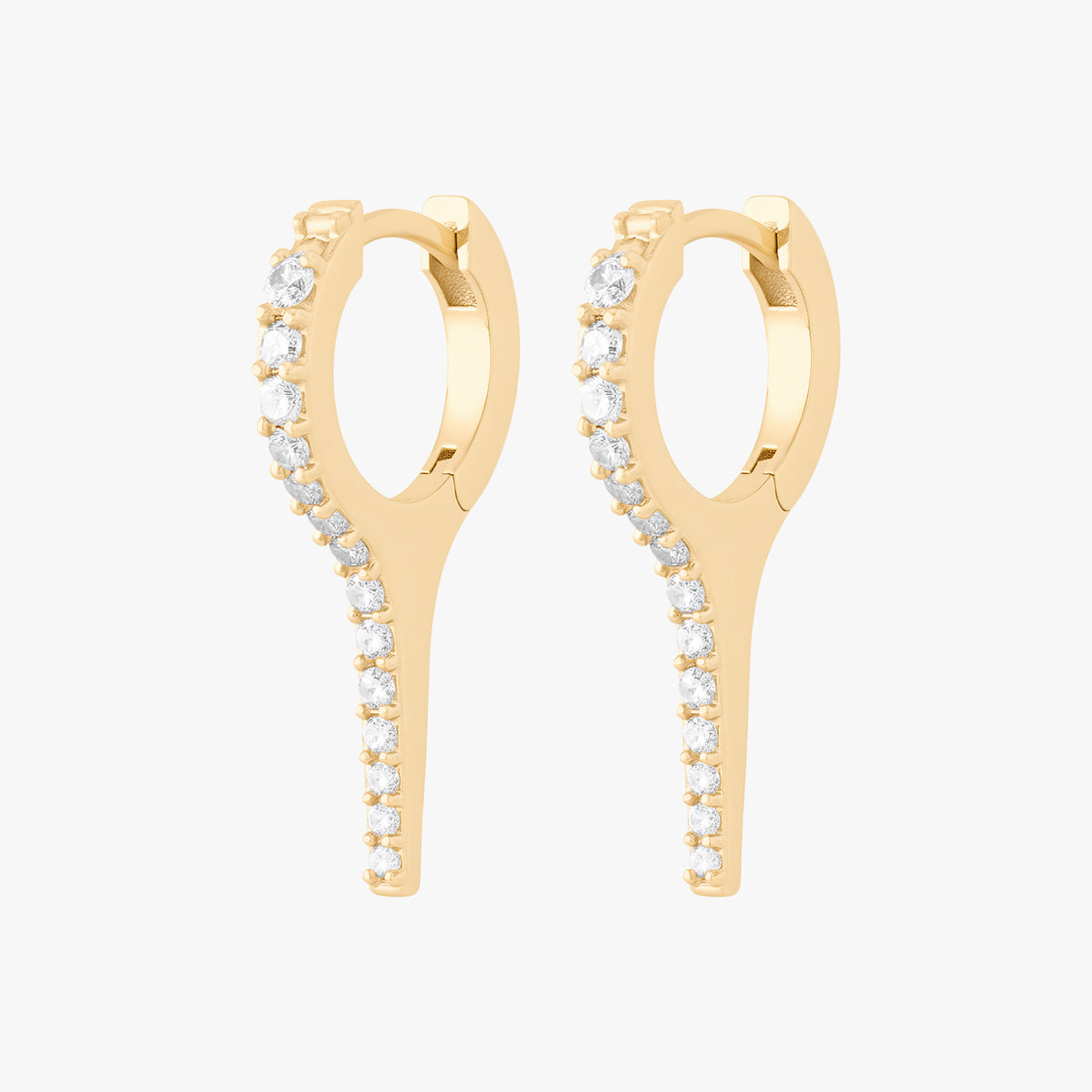 This image shows the side view of the 14k gold plated long pave spike huggie pair with cz clear stones down the front 