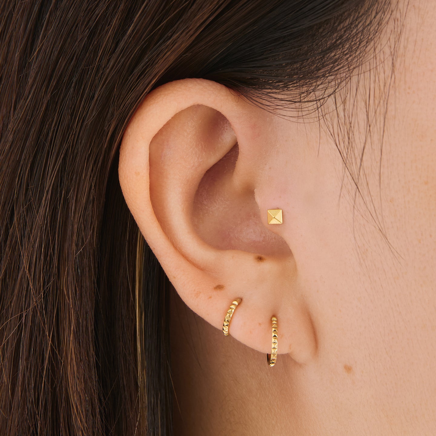 pyramid set featuring a 6mm pyramid clicker, 8mm pyramid clicker, and pyramid flatback stud in gold [hover] color:null|gold