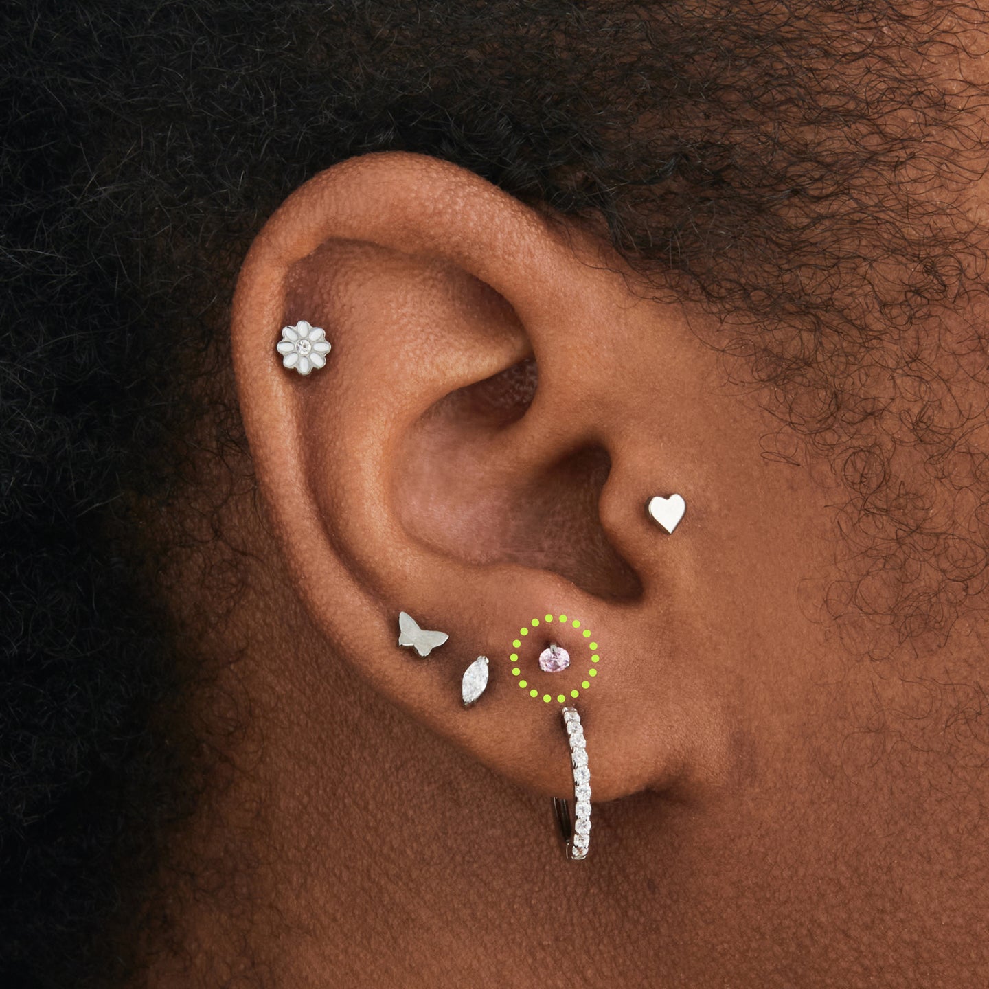 on ear image featuring the titanium flatback stud with a 2.5mm pink cz stone that comes with 2 backs in 6mm and 8mm lengths [hover] color:null|silver/pink