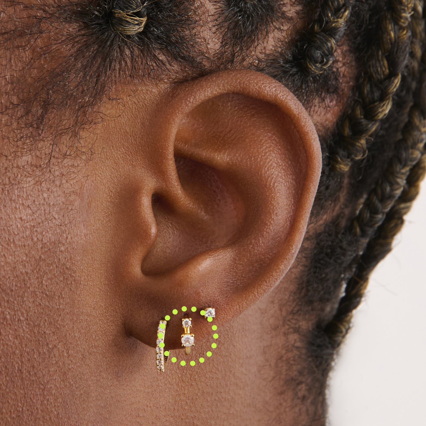 on ear featuring a micro huggie in gold with 2 mini cz stones [hover] color:null|gold/clear