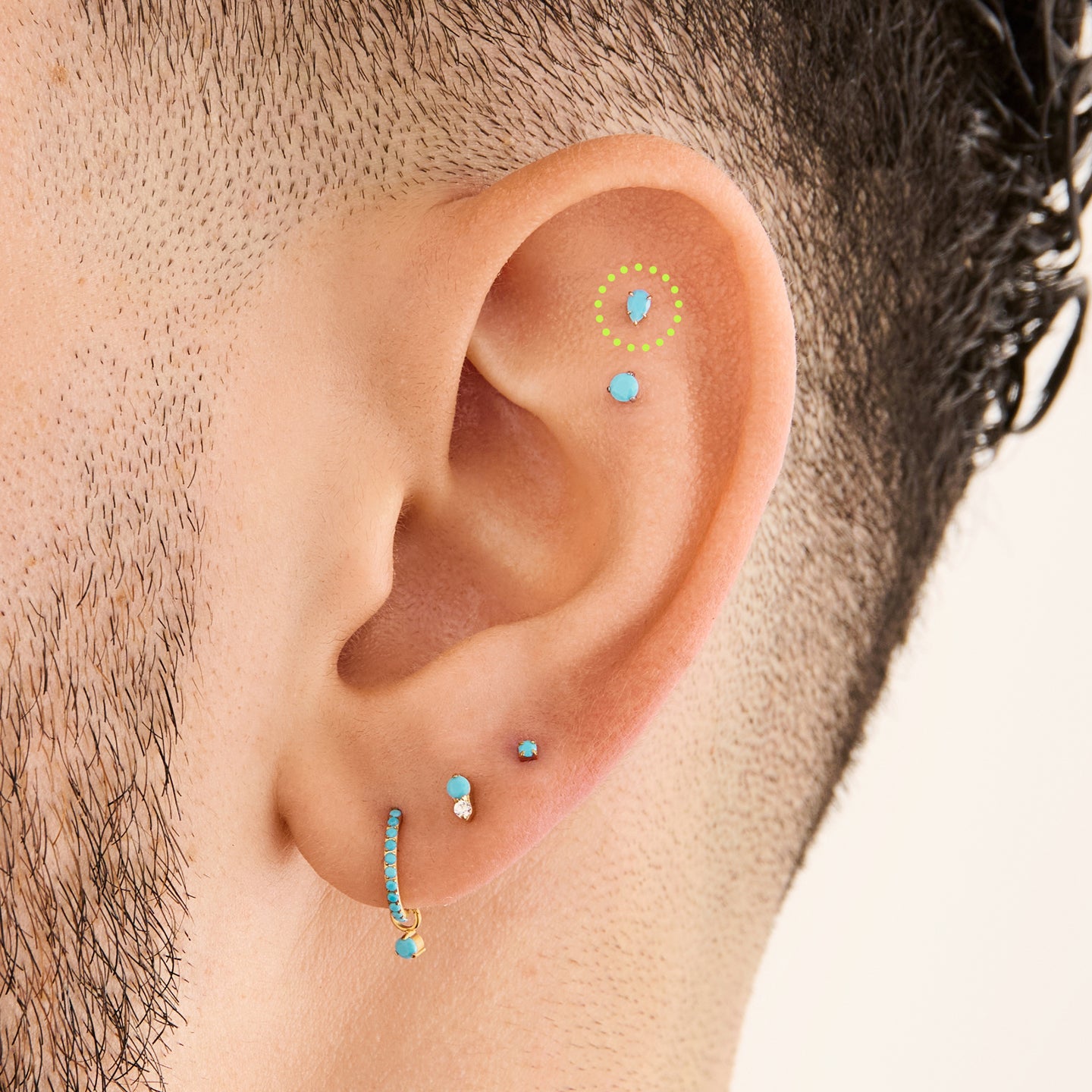 This is a 14K gold flatback stud with a pear shaped turquoise cz stone on ear. [hover] color:null|turquoise