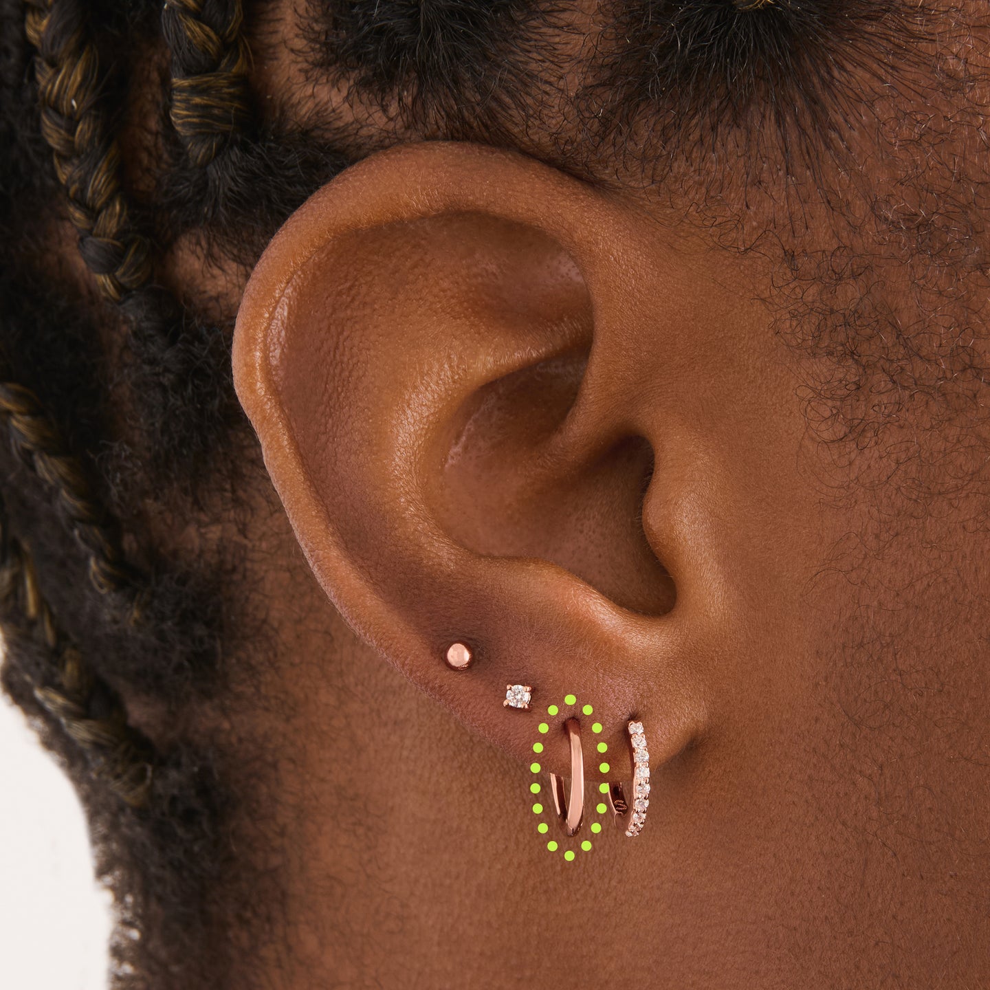 on ear featuring a rose gold small slim huggie [hover] color:null|rose gold