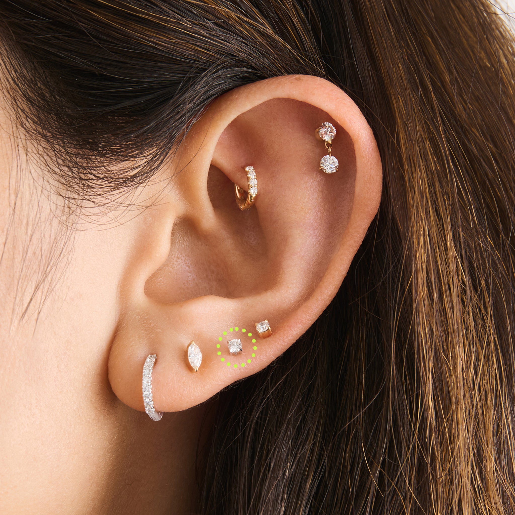 This is a 14k silver flatback stud with a clear mini lab-grown diamond on ear. [hover] color:null|silver/clear