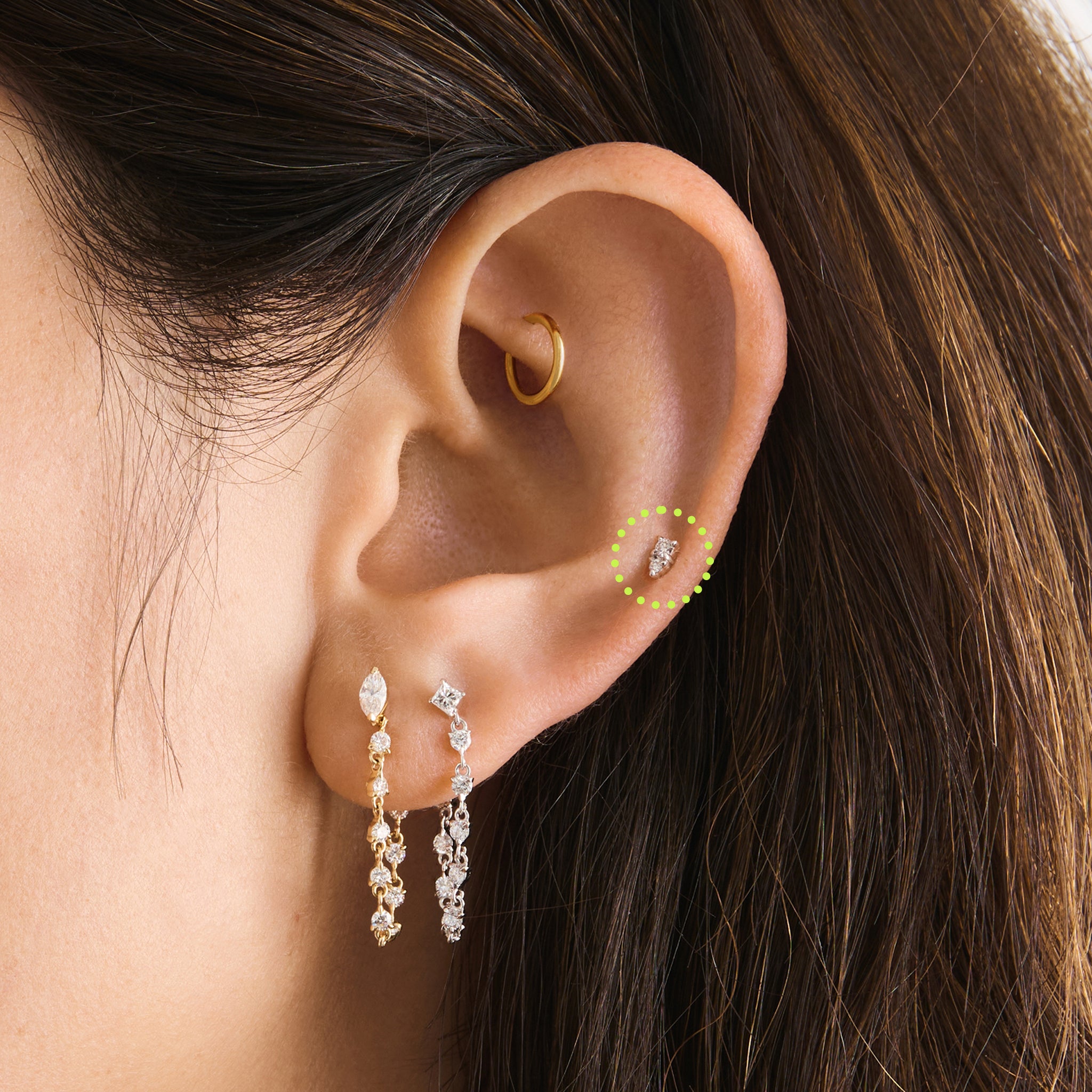 This is an image of a gold flatback stud with a clear stacked cz stone on ear. [hover] color:null|14k gold/clear