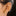 This is an image of a gold-toned huggie with twinkle star shaped engravings with CZs in them on ear. [hover] color:null|gold/clear