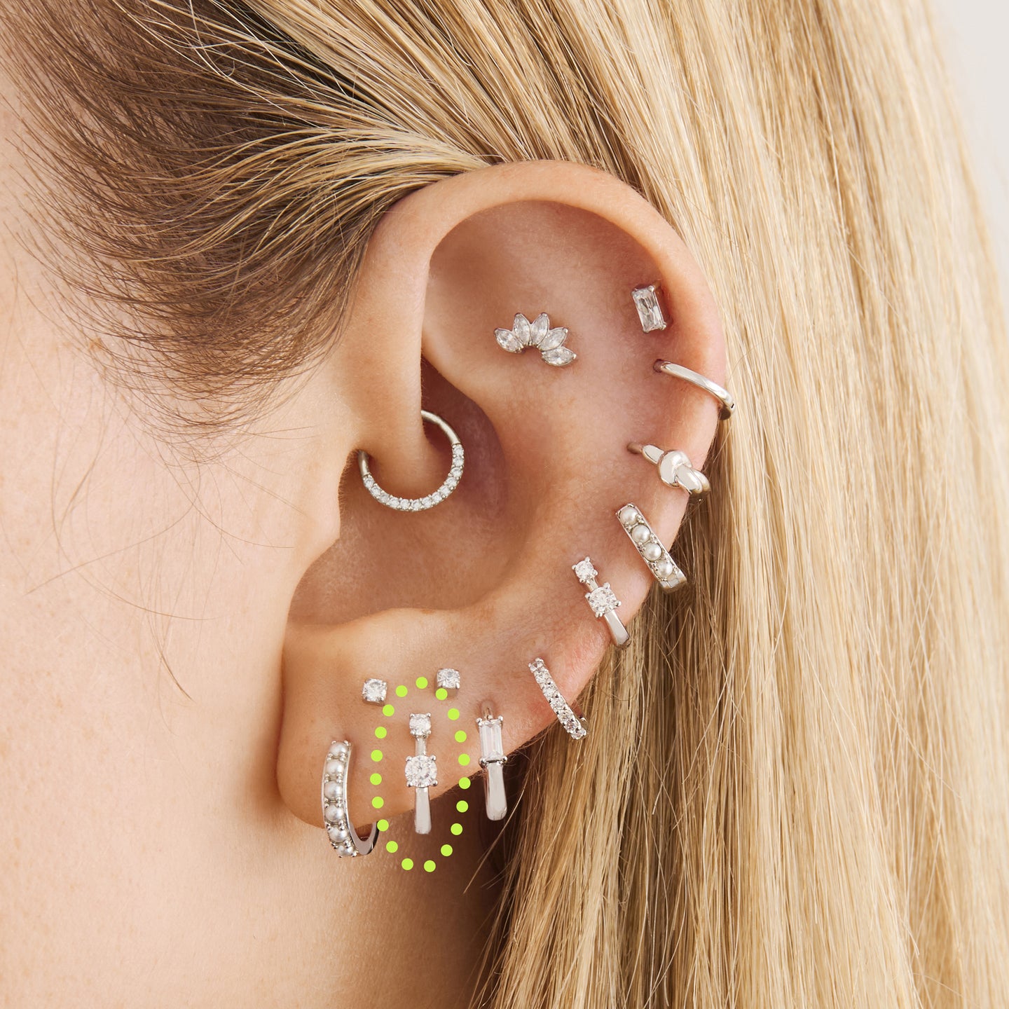 on ear featuring a mini huggie in silver with 2 mini cz stones [hover] color:null|silver