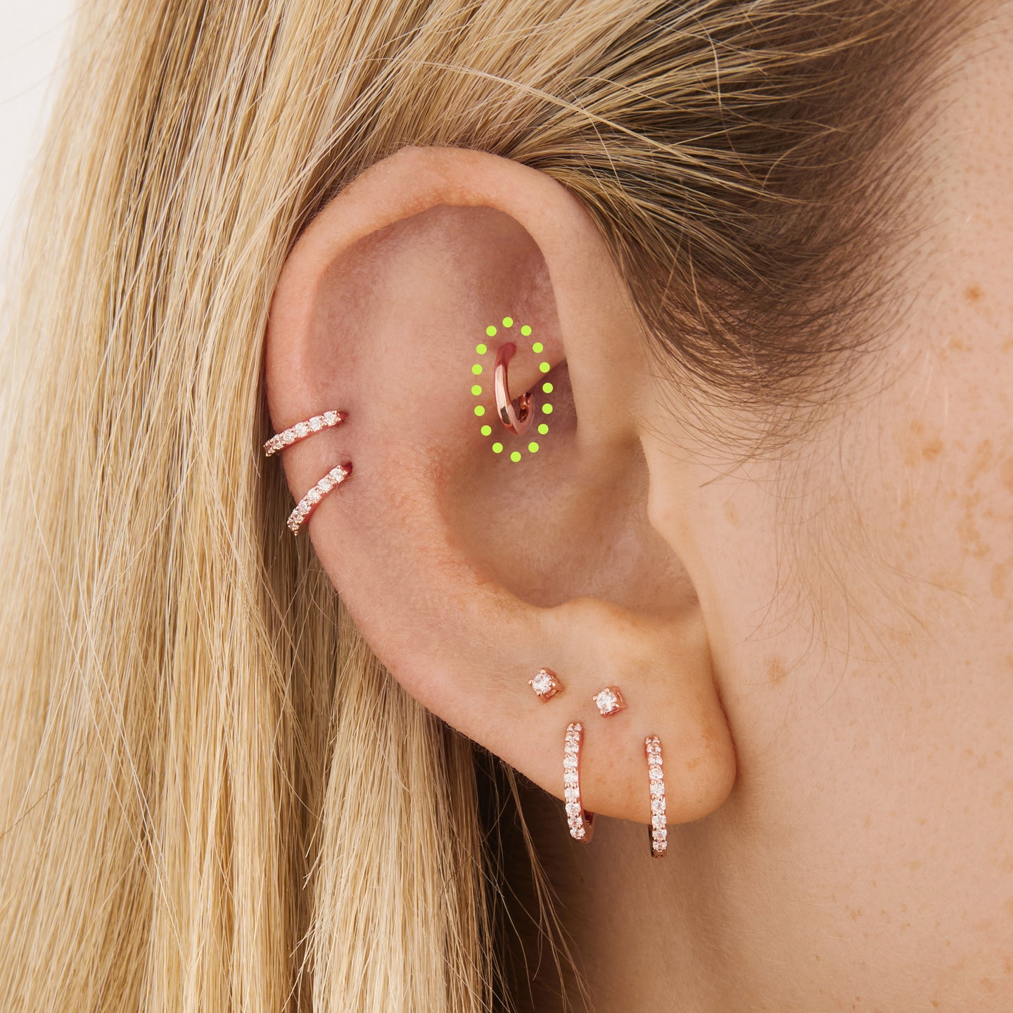 on ear featuring micro rose gold slim huggie [hover] color:null|rose gold