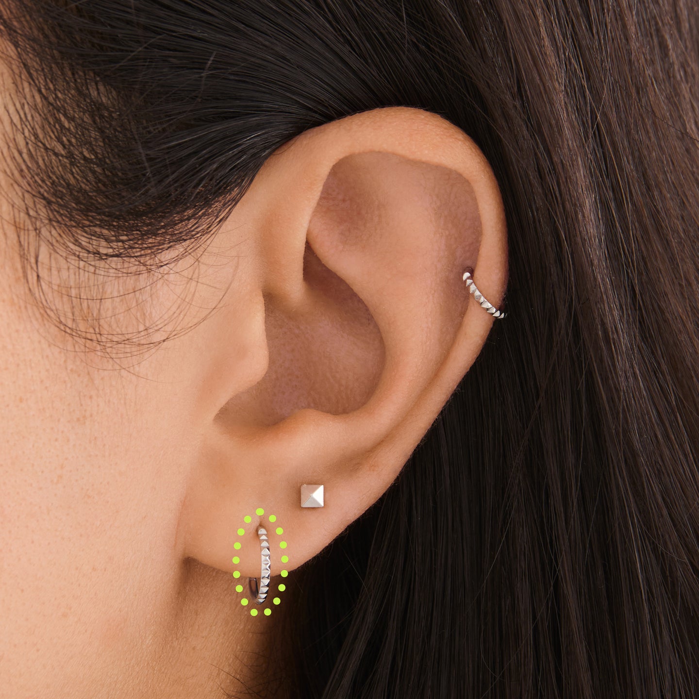 on ear featuring a 8mm pyramid clicker in silver [hover] color:null|silver