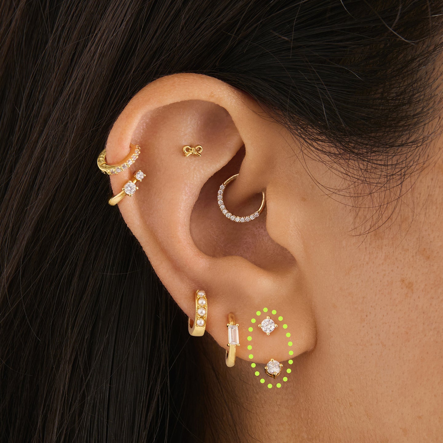 on ear featuring a gold cz jacket stud [hover] color:null|gold/clear