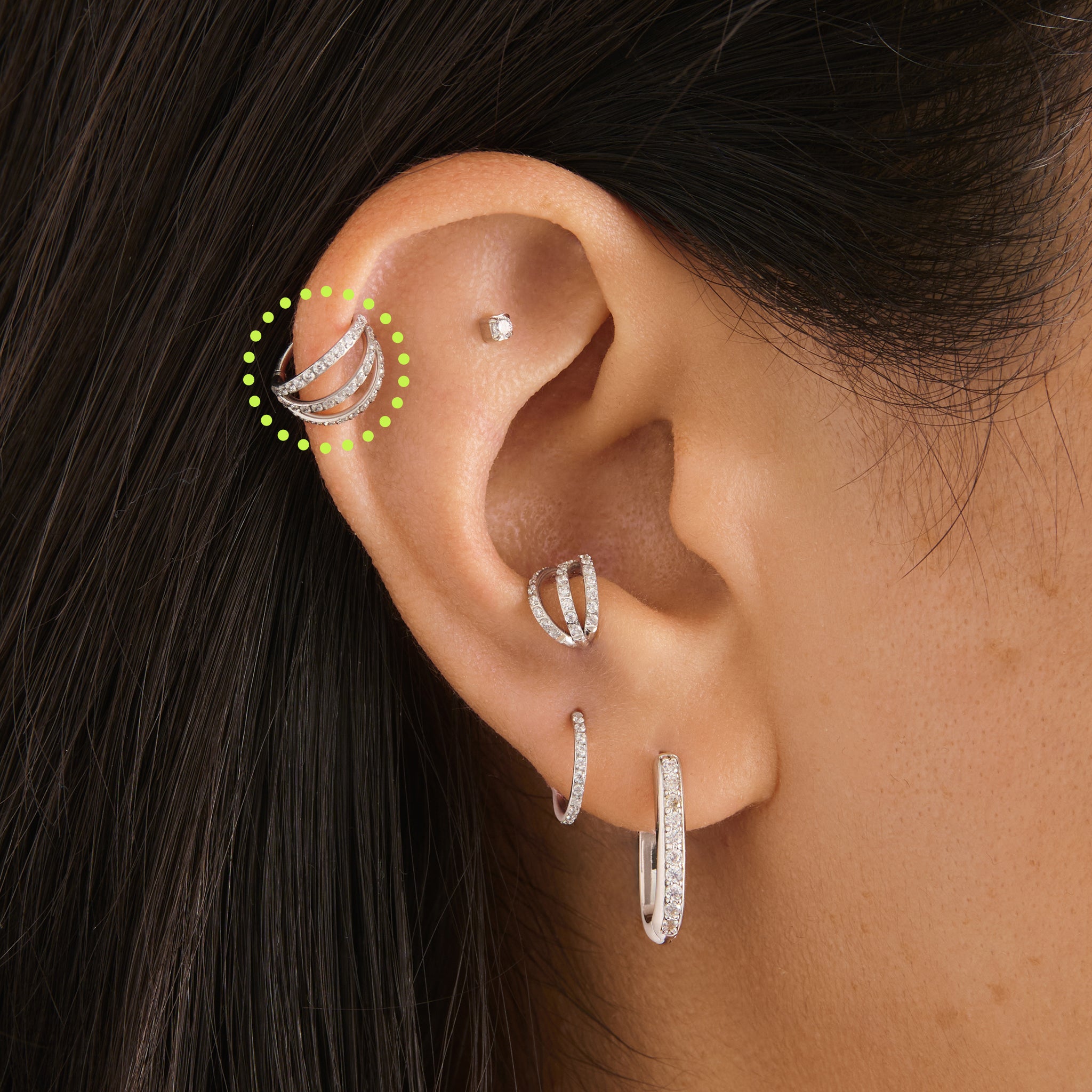 on ear featuring a silver triple pave clicker with cz stone accents [hover] color:null|silver/clear