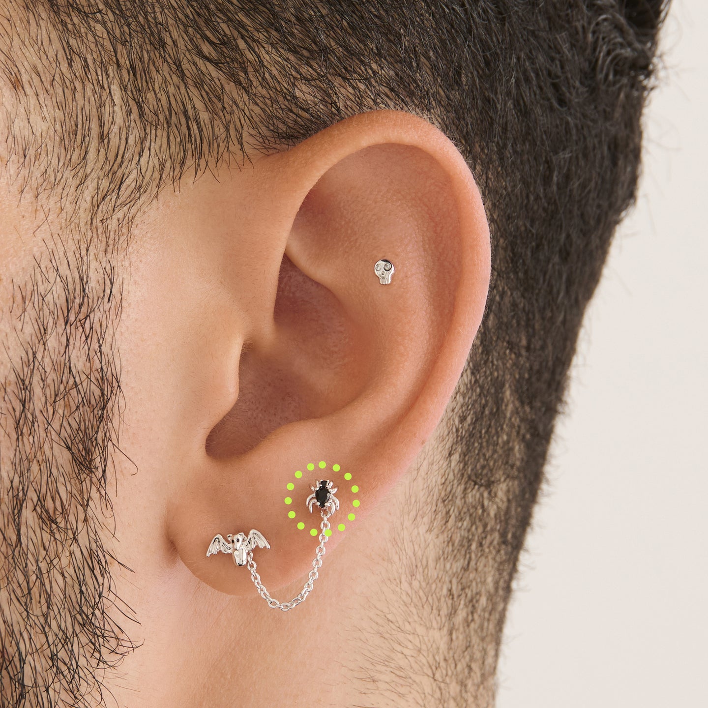 on ear featuring a silver spider stud with black cz accents [hover] color:null|silver/black