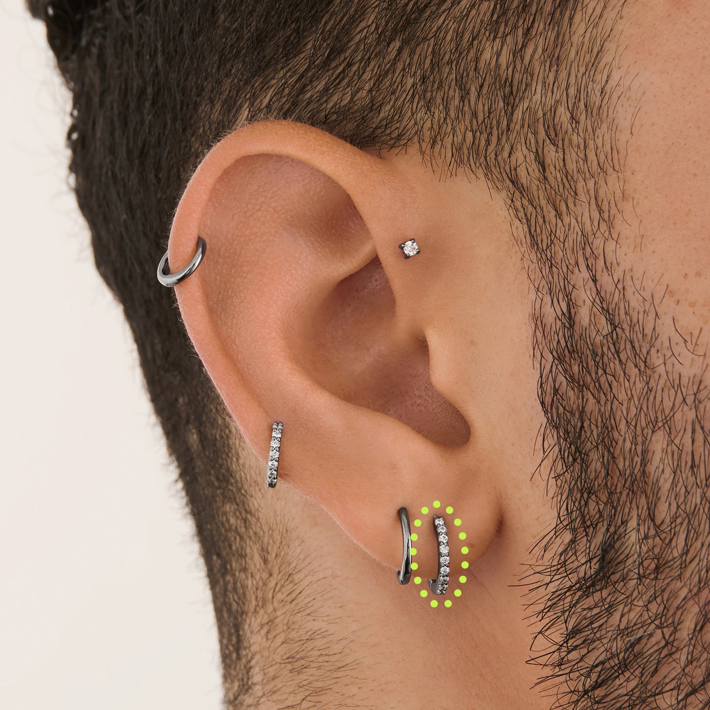 on ear featuring a mini pave huggie in gunmetal with clear stones [hover] color:null|gunmetal