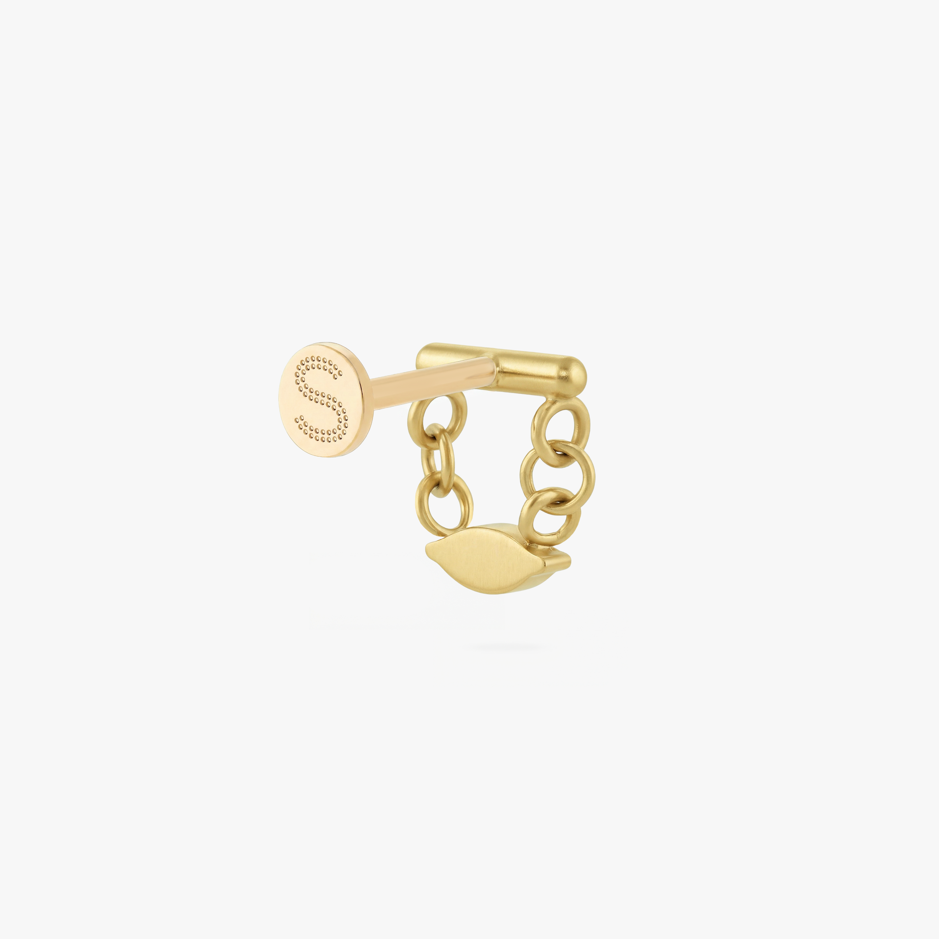 This is an image of a gold toned flatback stud that has a gold bar with chains hanging from both sides supporting a clear, marquise cut CZ stone.