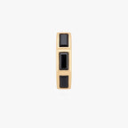 this image shows the front view of the 14k gold plated max bezel baguette huggie with black cz baguette stones. 