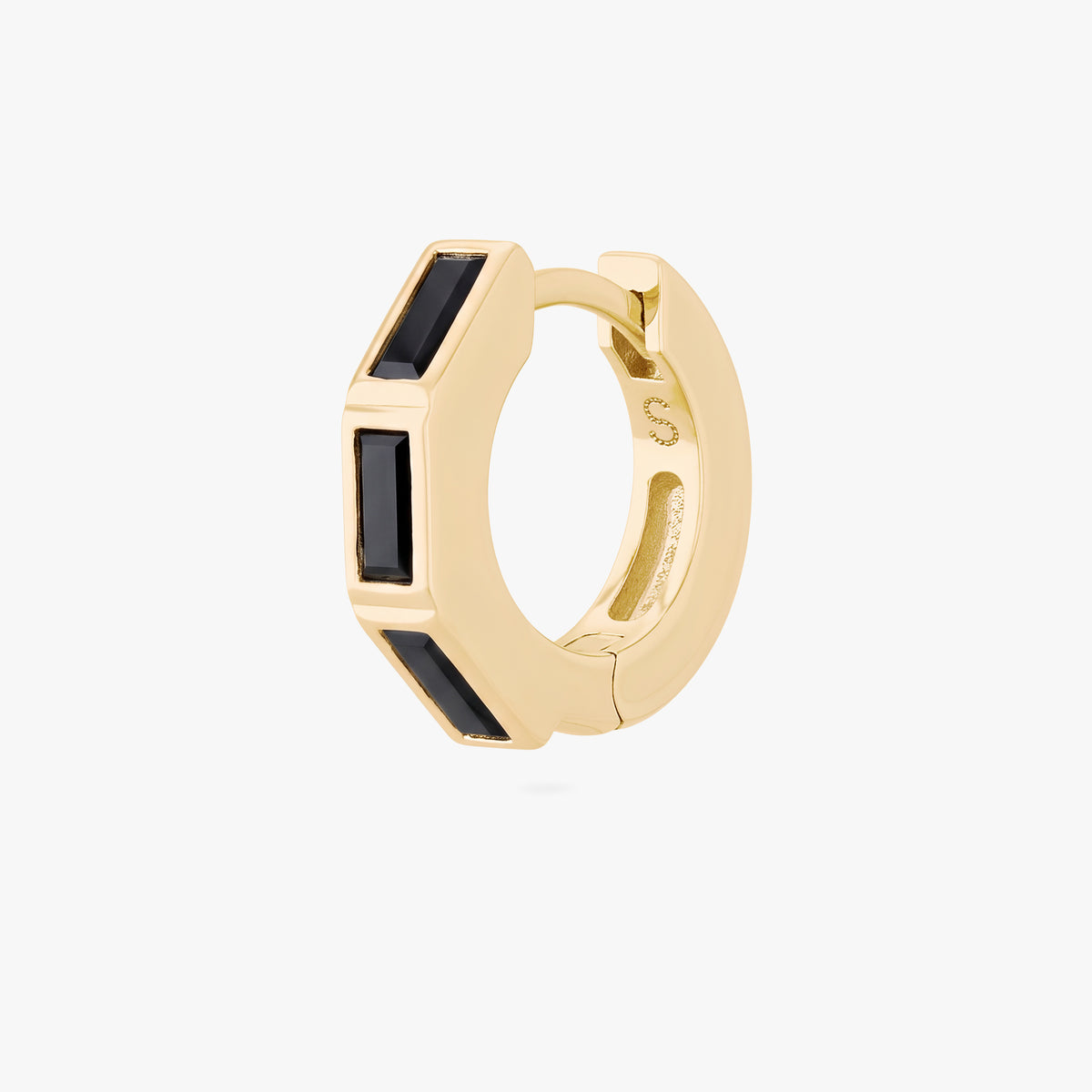 this image shows the side view of the 14k gold plated max bezel baguette huggie with black cz baguette stones. 