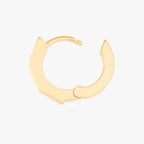 this image shows the open side view of the 14k gold plated max bezel baguette huggie with clear cz baguette stones. 