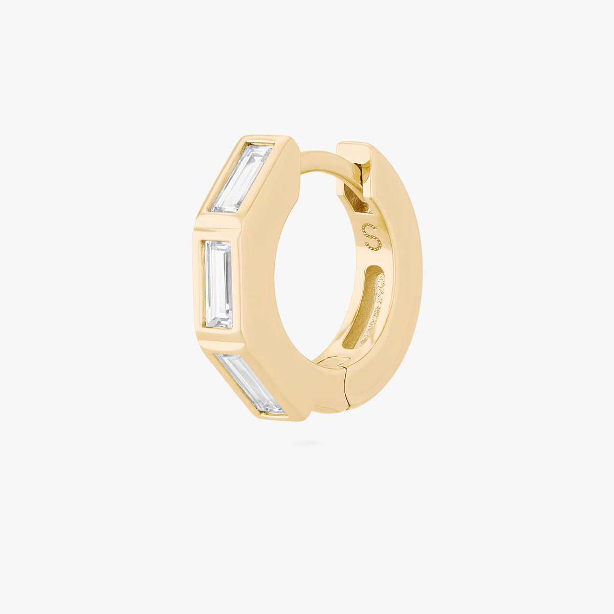 this image shows the side view of the 14k gold plated max bezel baguette huggie with clear cz baguette stones. 