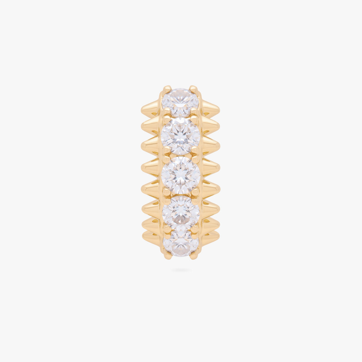this image shows the front view of the 14k gold plated max pave spike huggie. this huggie has clear cz stones and gold spikes up and down the sides 