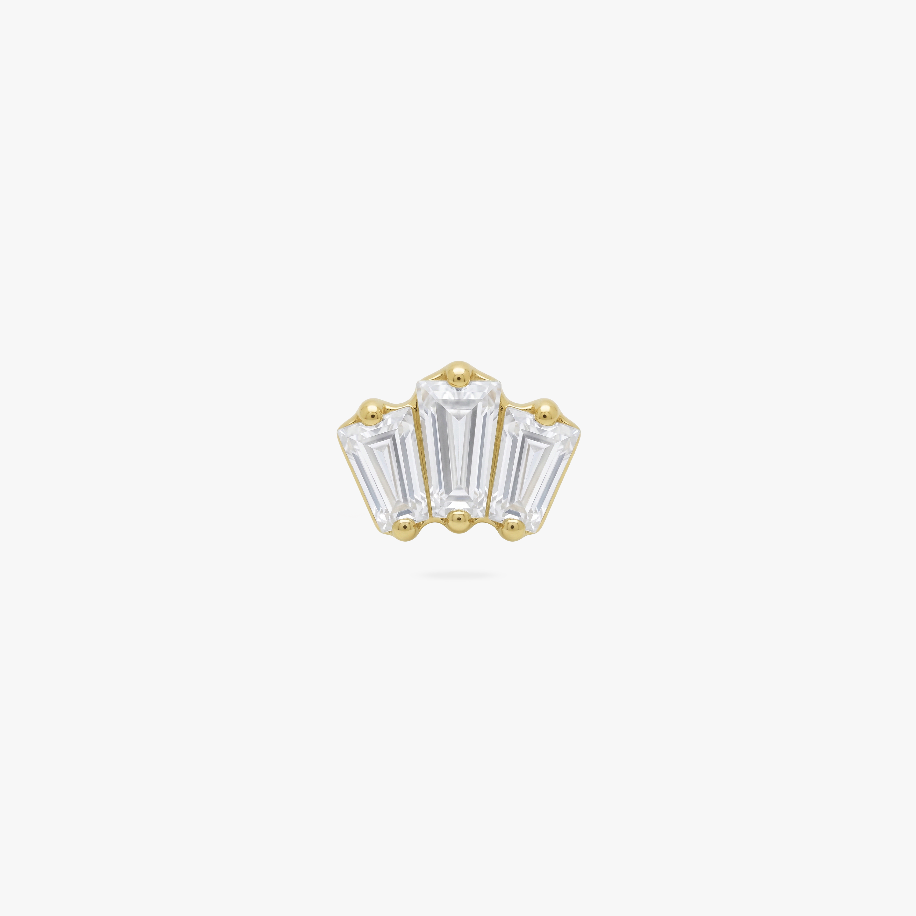 This is an image of a gold toned flatback stud that has three clear baguette cut CZs forming a crown shape. 