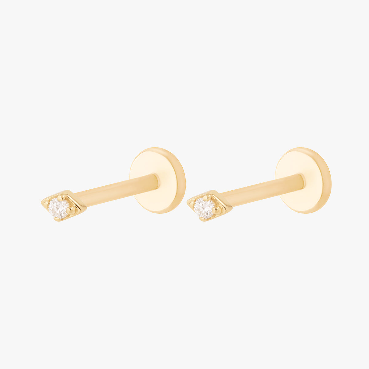 this image shows the side view of a pair of the 14k gold kite flatback with a clear cz stone in the middle 