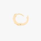 this image shows a side view of a 14k gold plated huggie with three cz stones. one pink and two clear 