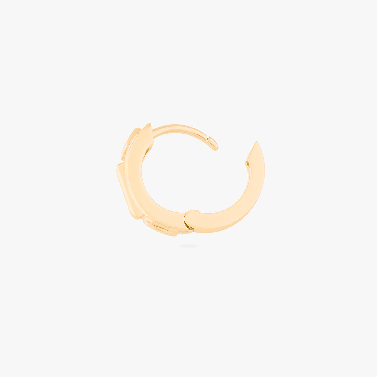 this image shows a side view of a 14k gold plated huggie with three cz stones. one pink and two clear 