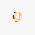 this image shows the front of a 14k gold plated huggie with three blue circular cz stones