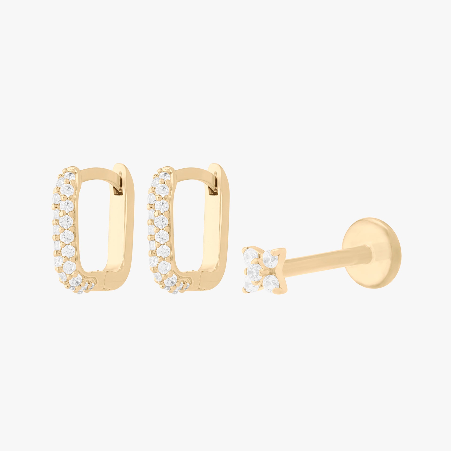 A gold earscape set featuring a pair of square pave huggies and a pave x flatback with clear stones - Main view