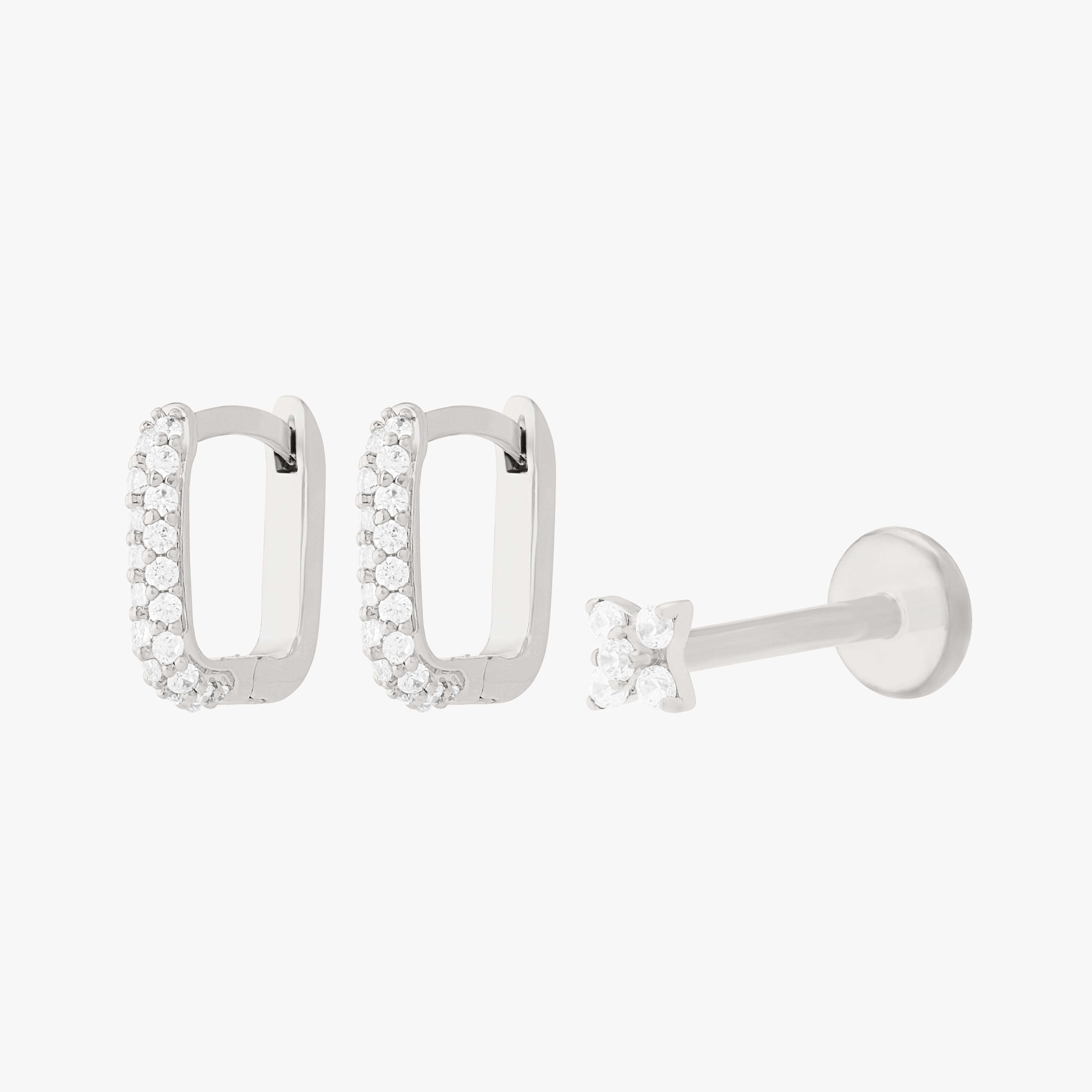 A silver earscape set featuring a pair of square pave huggies and a pave x flatback with clear stones - Main view