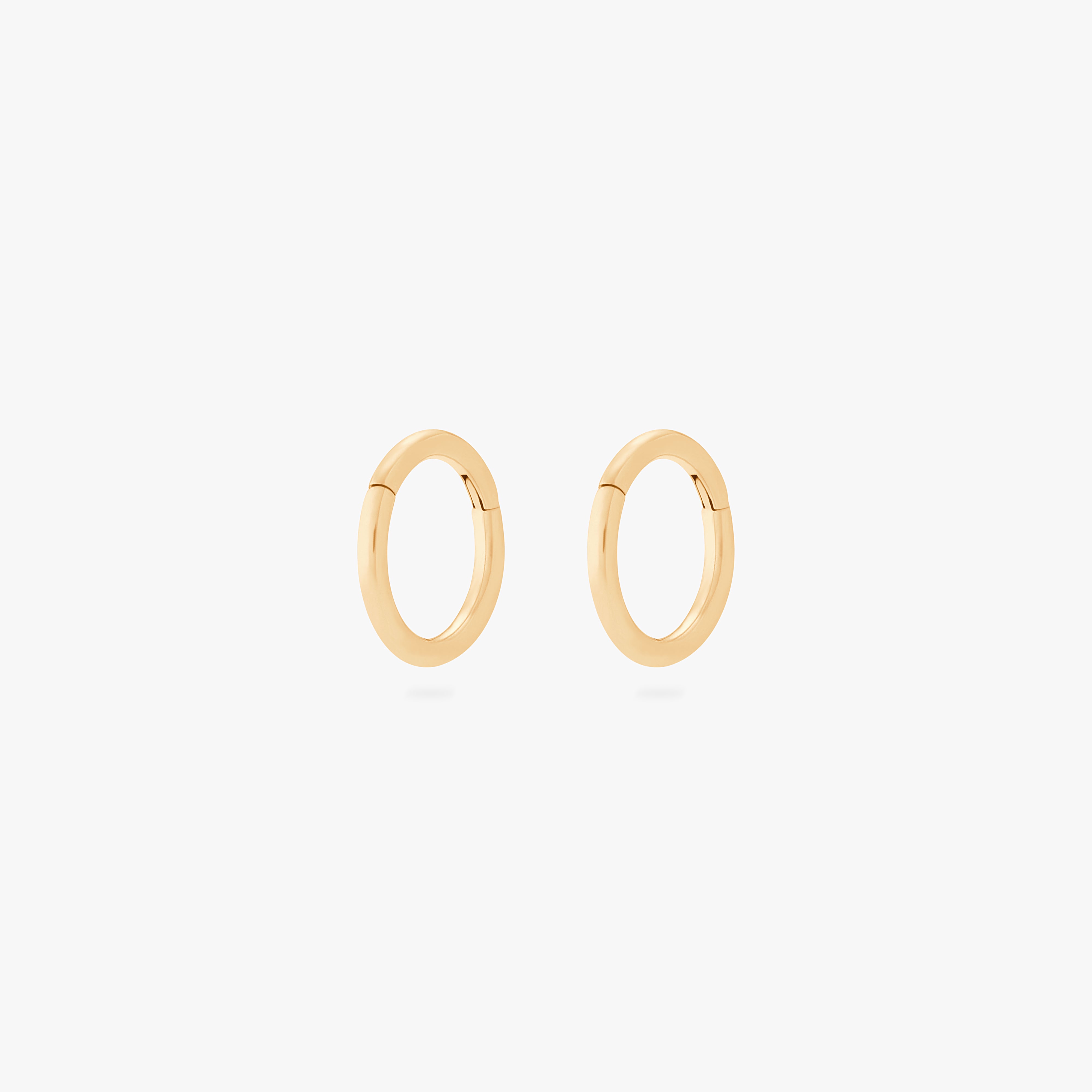 This is an image of a pair of gold clickers with 6mm inner diameters. [pair] color:null|gold