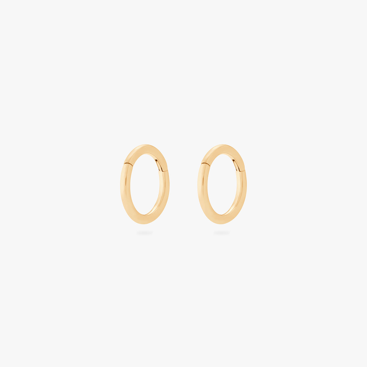 This is an image of a pair of gold clickers with 6mm inner diameters. [pair] color:null|gold